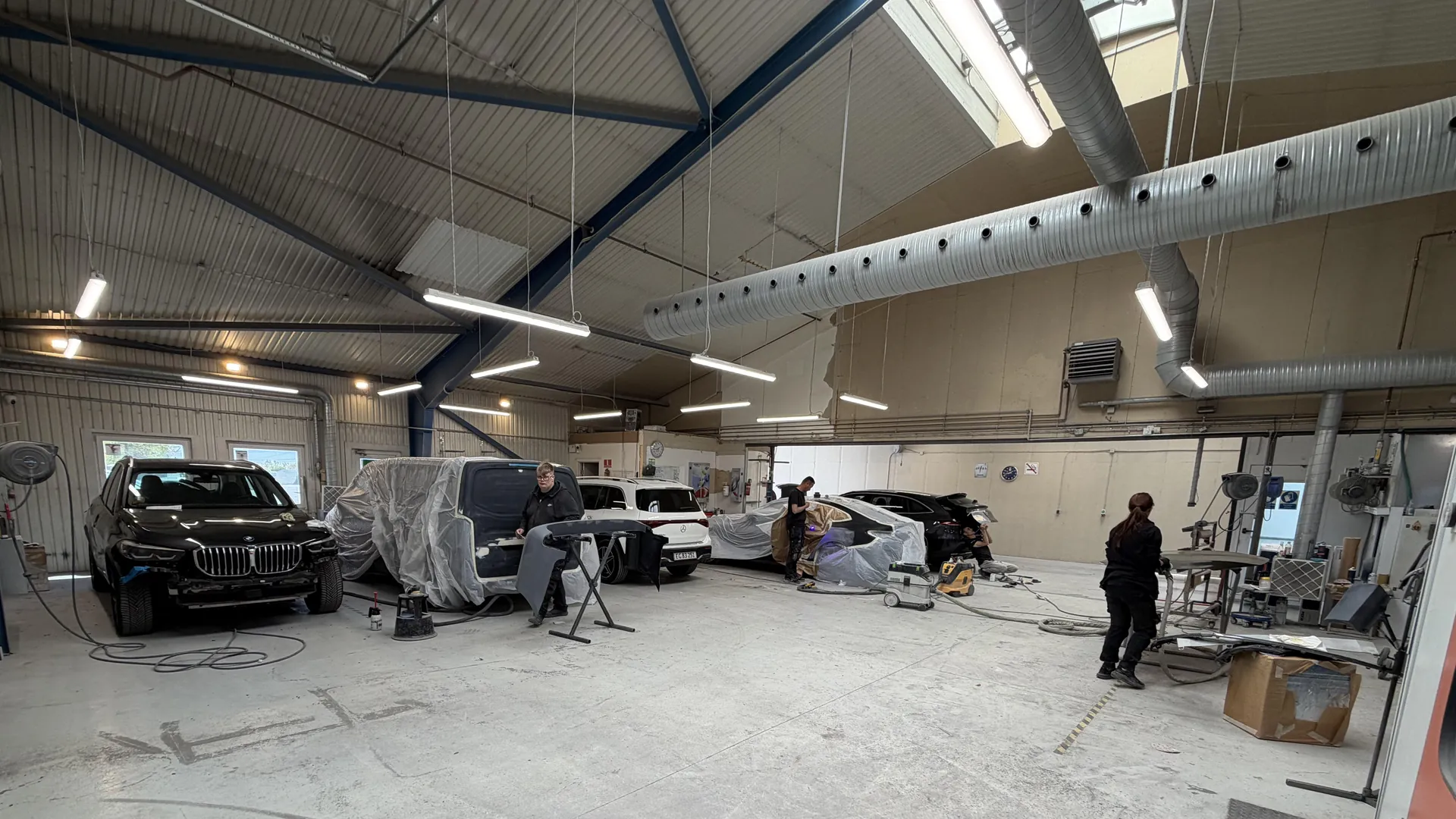 Workshop with workers on panels — candid working scene