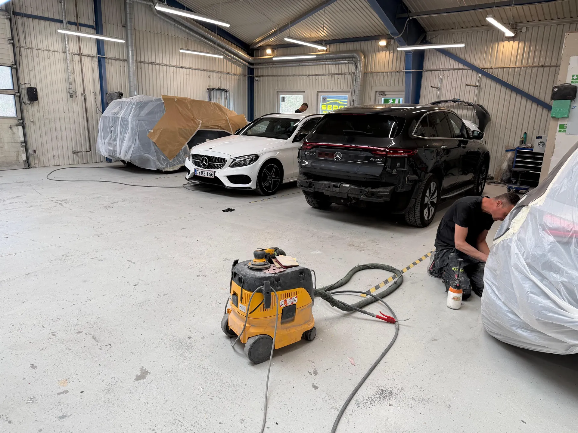 Two premium Mercedes side-by-side (C-class + EQS) — premium customer base signal